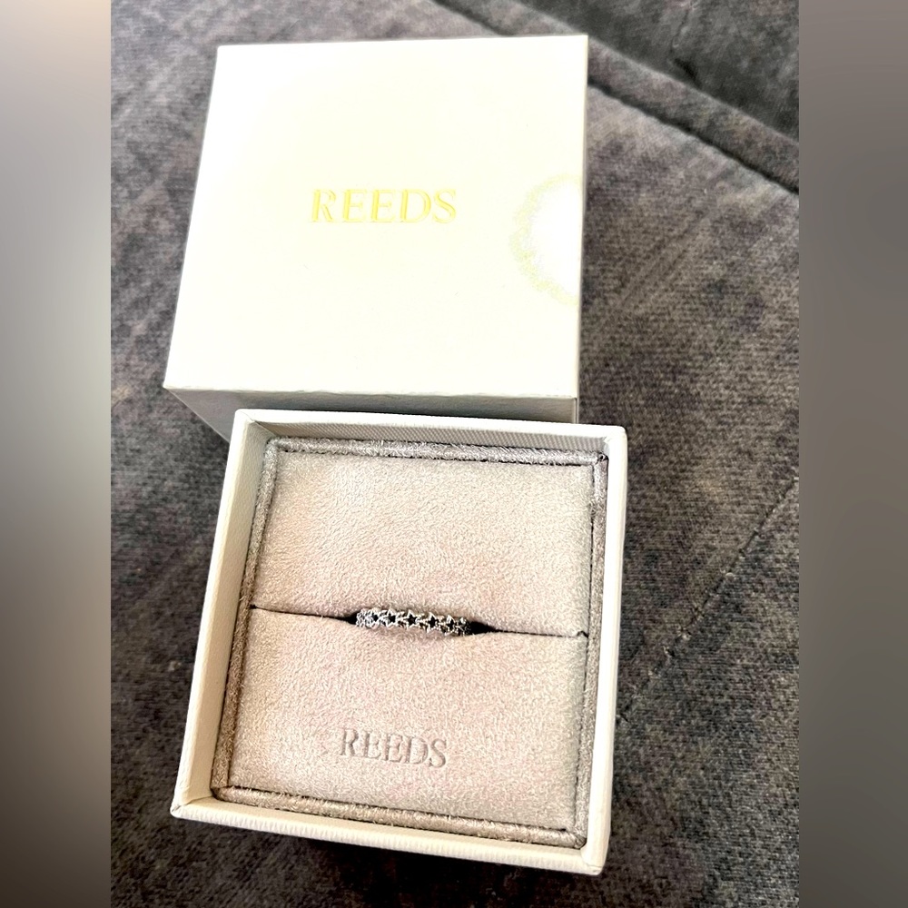 Pandora band of asymmetric stars ring